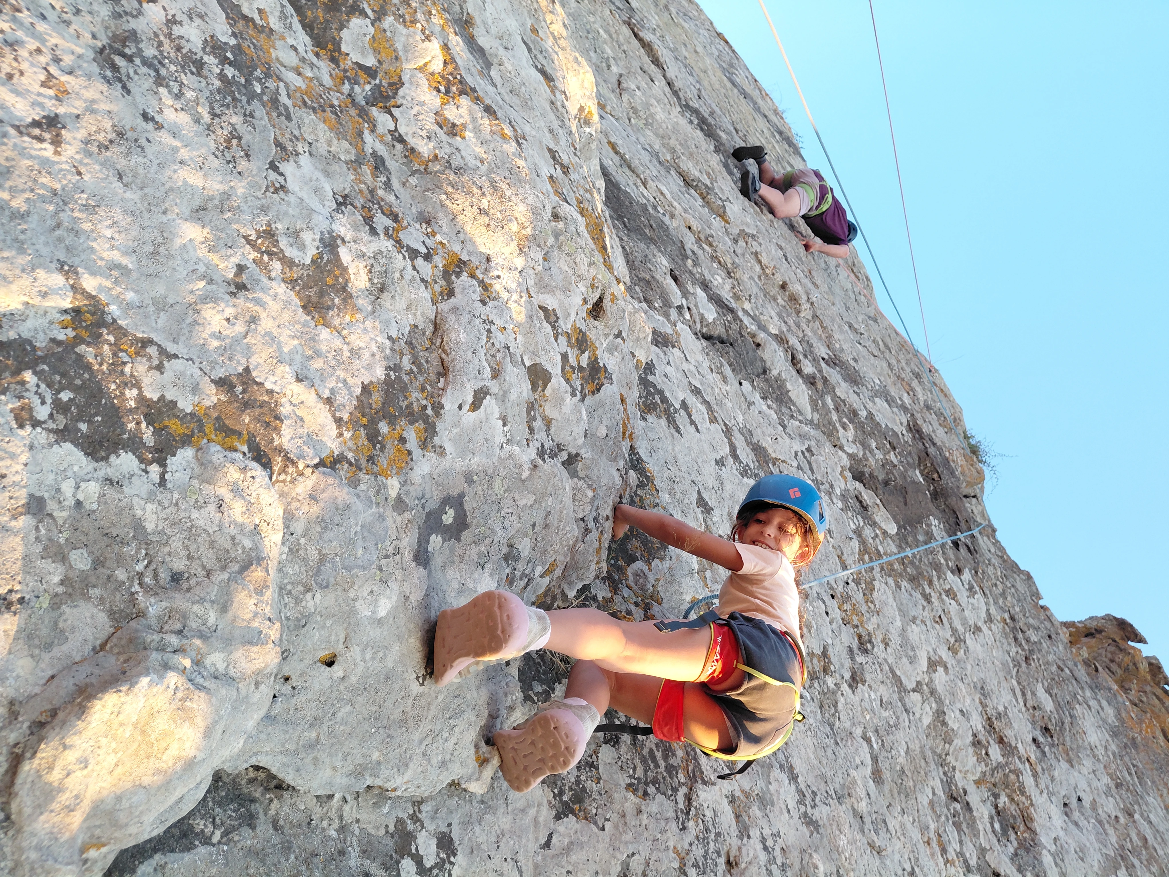 Young climbers on an outdoor rock route in Cyprus